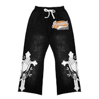 a black and white sweatpants with an image of a cross